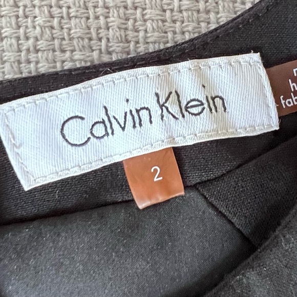 Calvin Klein sheath dress with gold accents and shallow V-neck front. - Picture 5 of 7